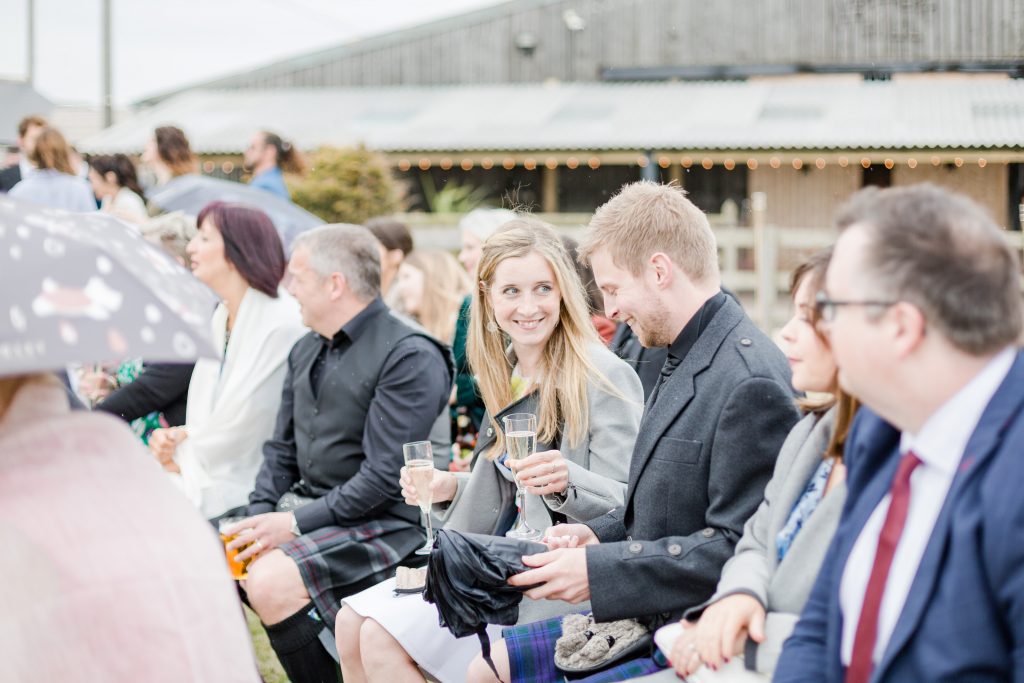 wedding guests smiling at festival style wedding