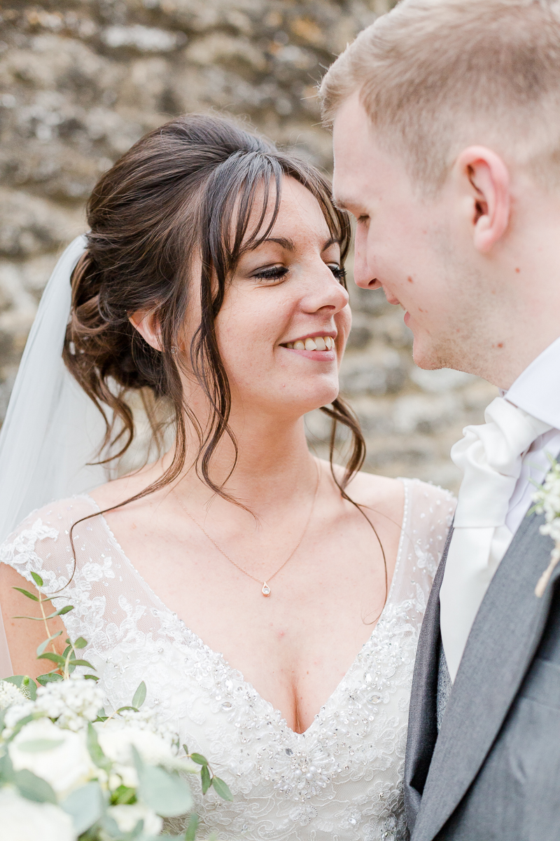 bride and groom nearly kiss