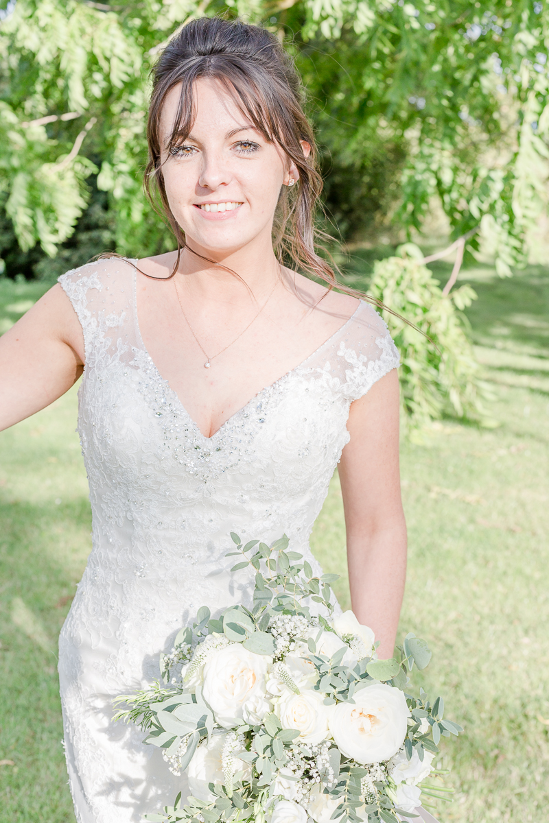 bride outside smiling into camera