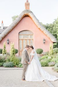 bride and groom in gardens with heads together