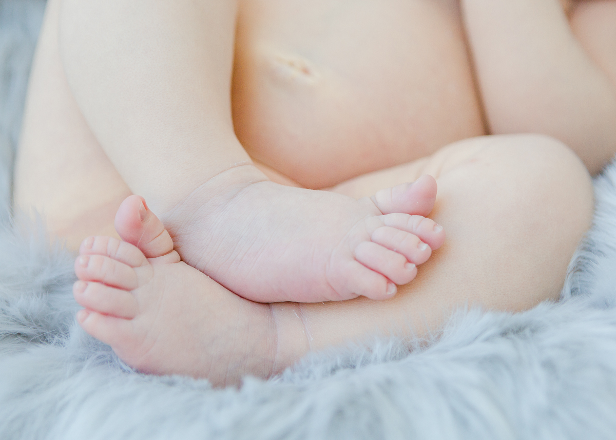 baby toes on blue fur