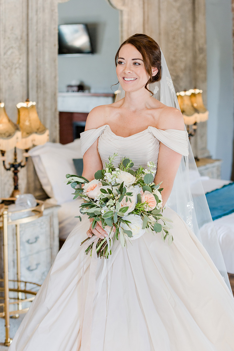 bride dressed holding bouquet ready to go