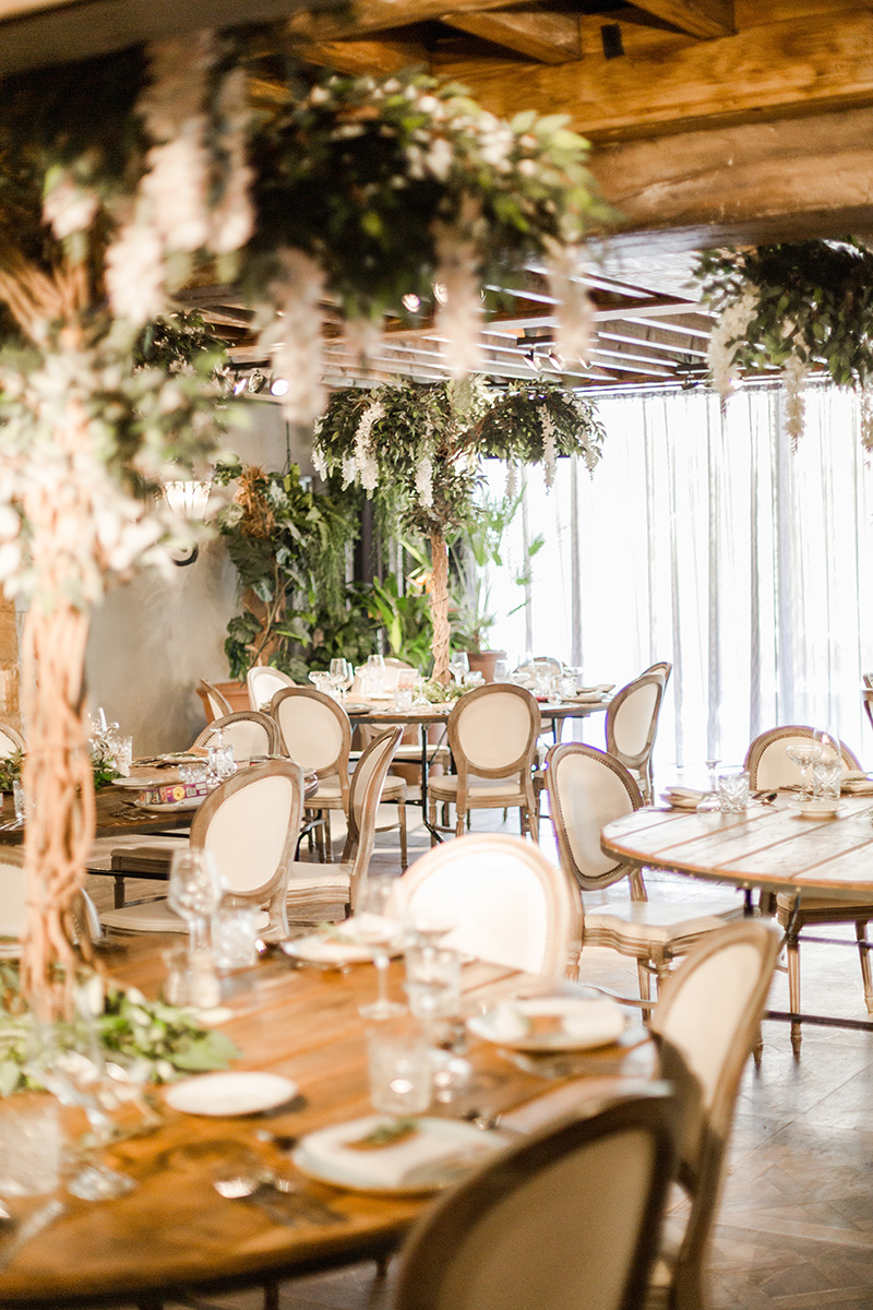 tables set with meditteranean trees as centre pieces