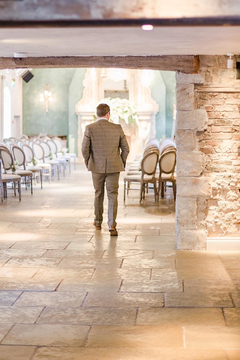 groom walking into ceremony room