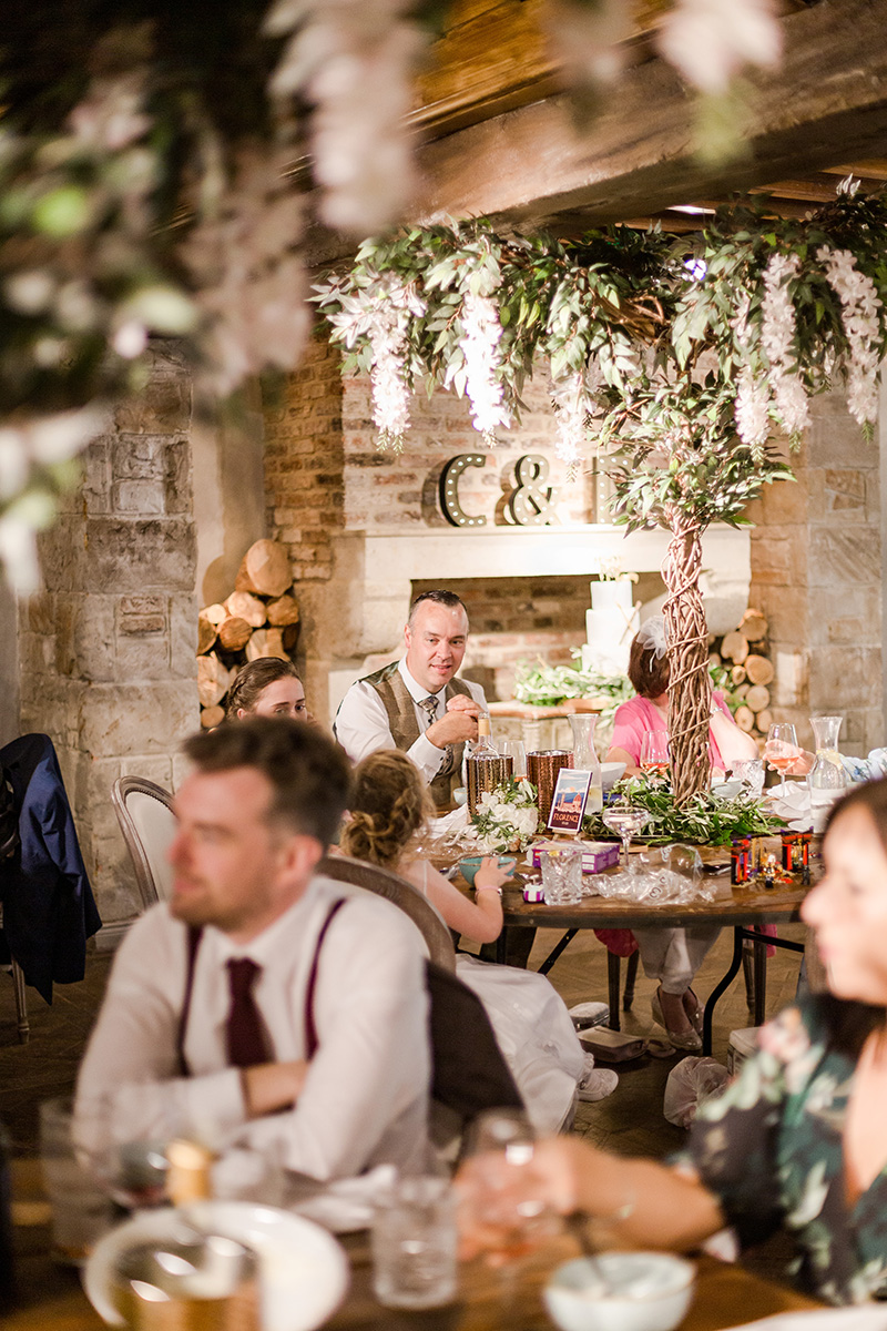 groomsman sat at wedding table