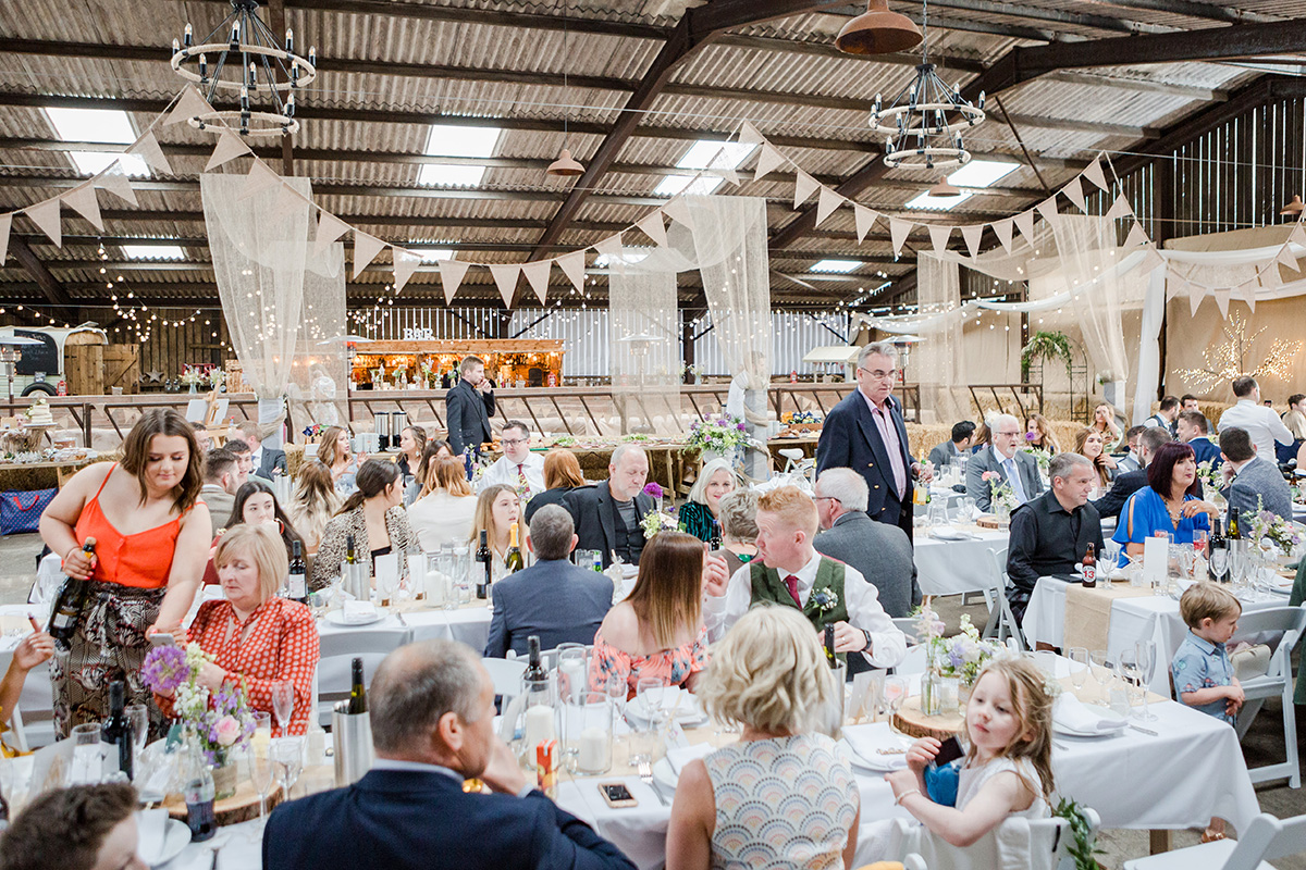 Festival wedding meal with bunting and long tables