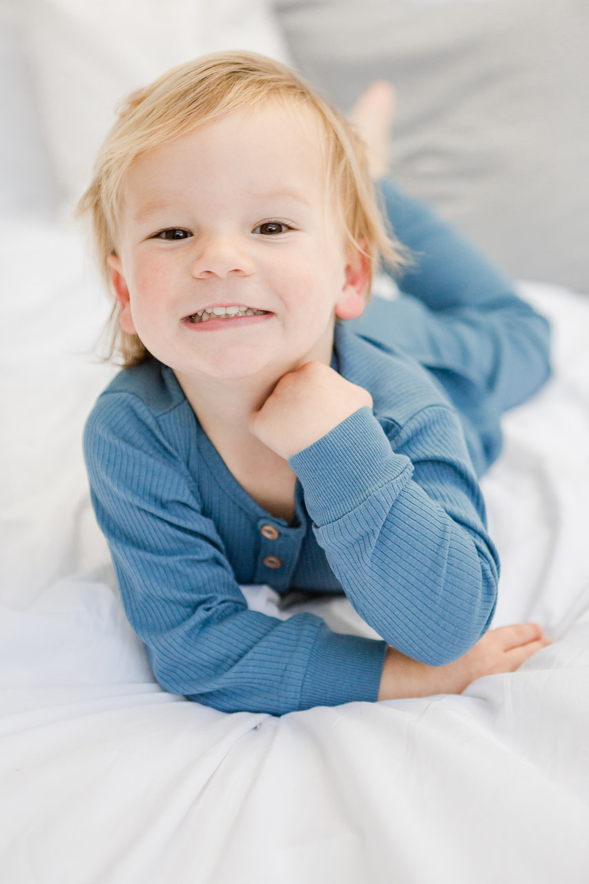 little boy lying on tummy for photoshoot