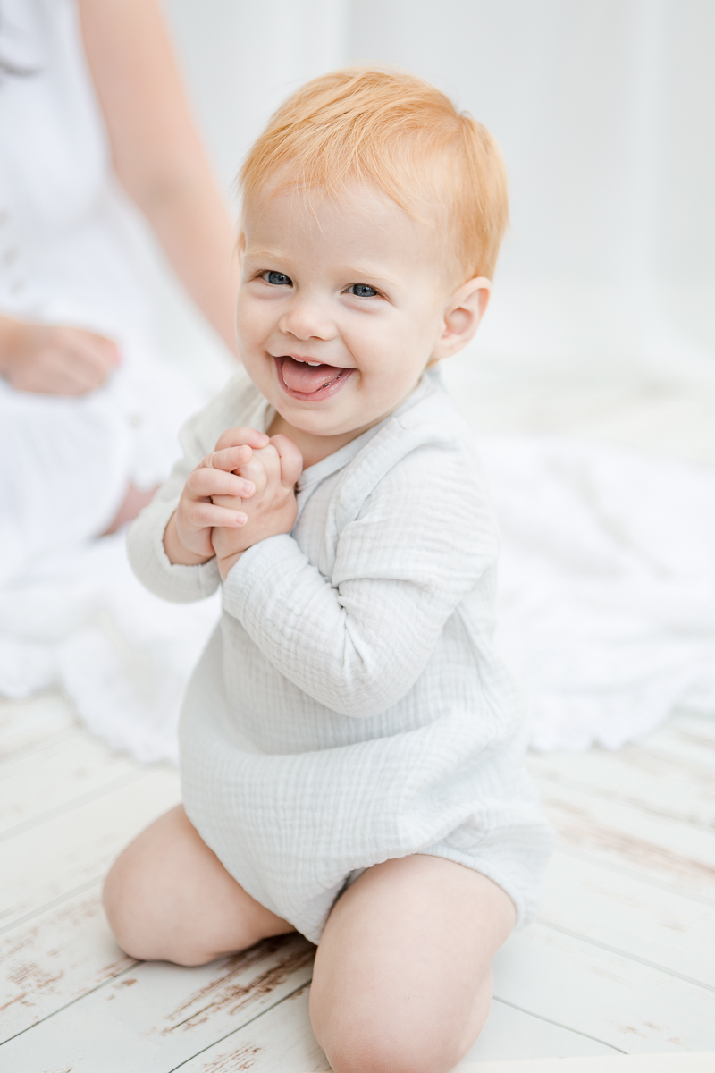 mummy and me photography session baby girl smiling at camera