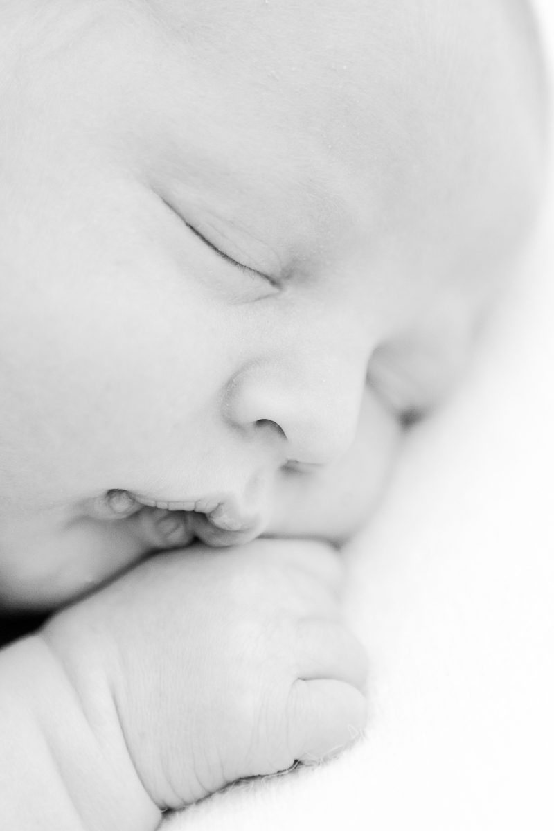 black and white closeup of sleeping baby's face