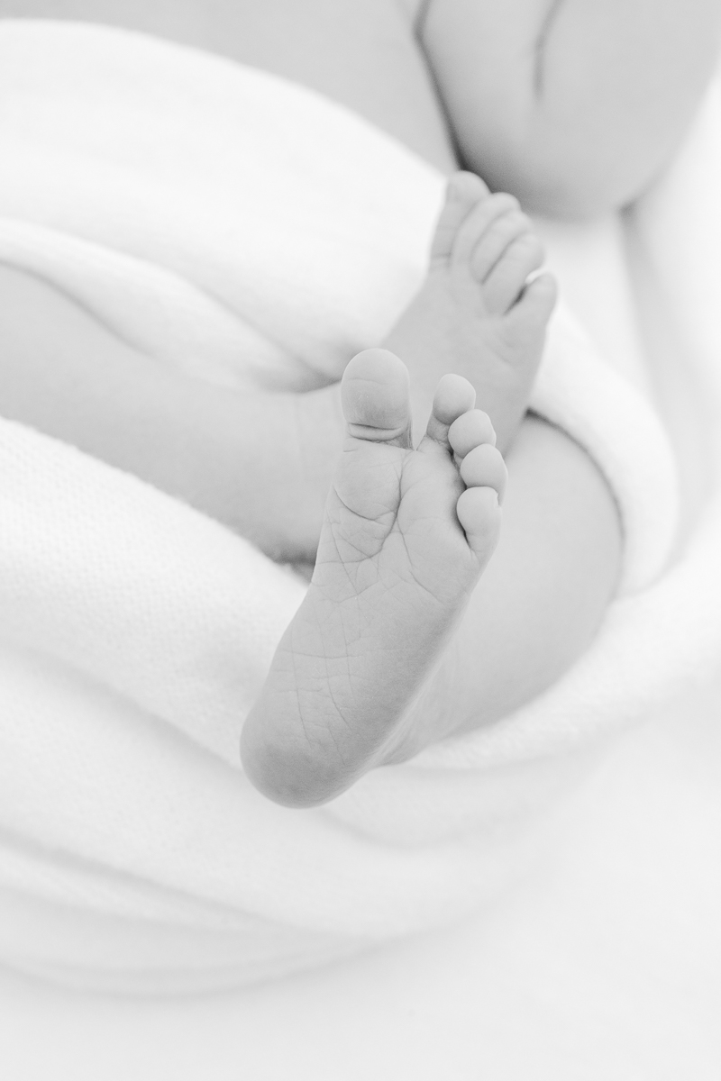 black and white newborn baby feet