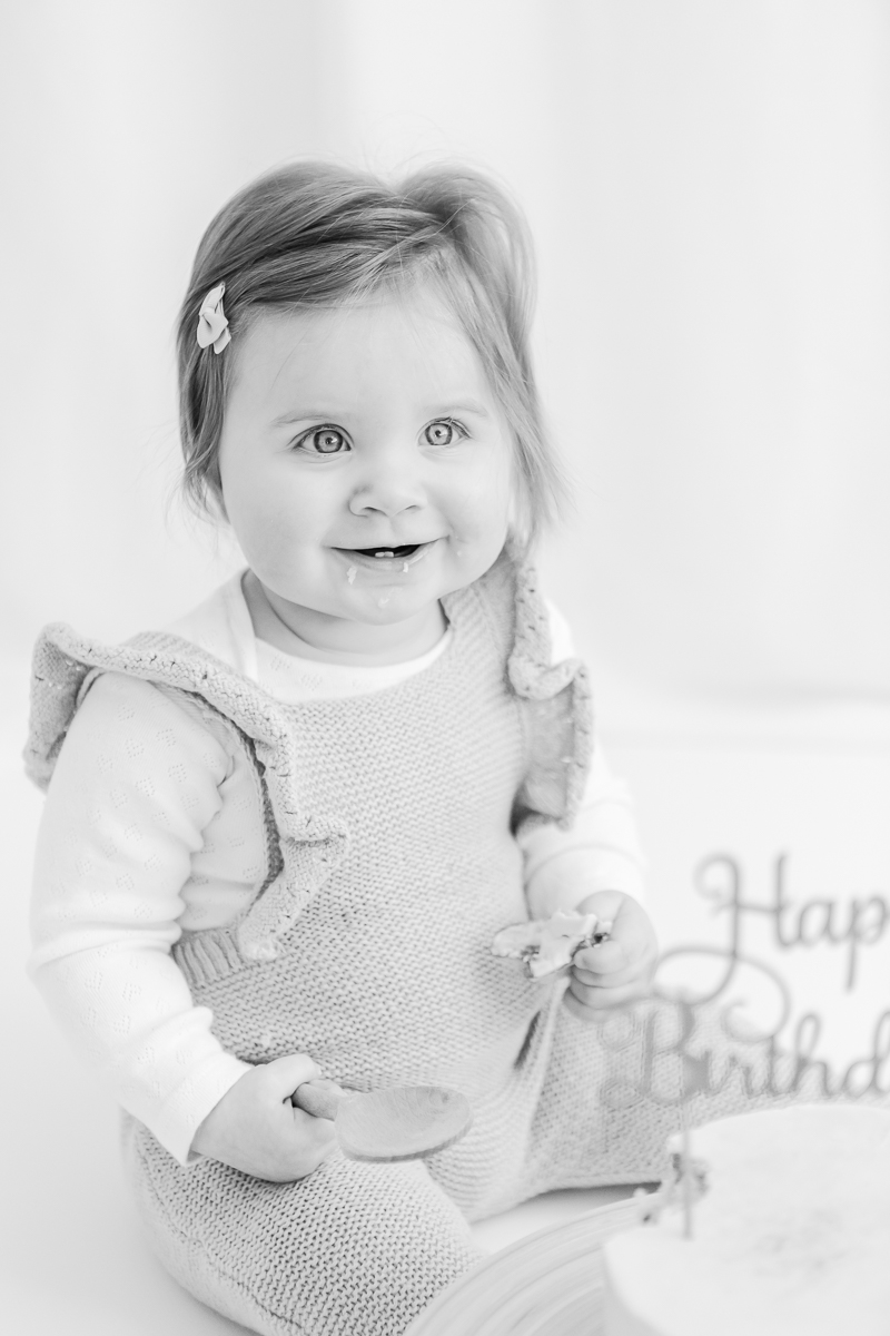 black and white cake smash photo of little girl