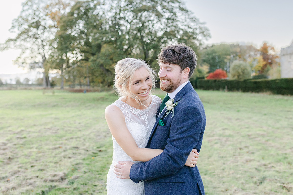 Bride and groom hugging and laughing