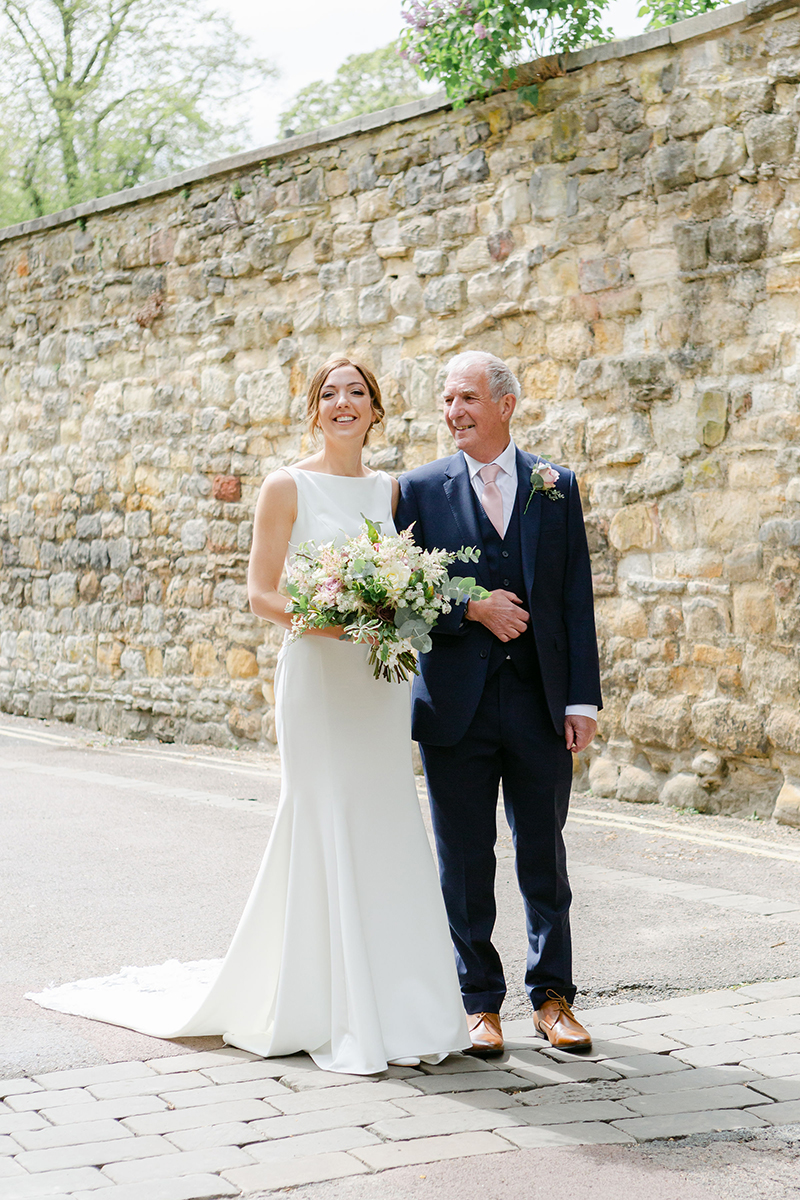 Bride walking with father of the bride