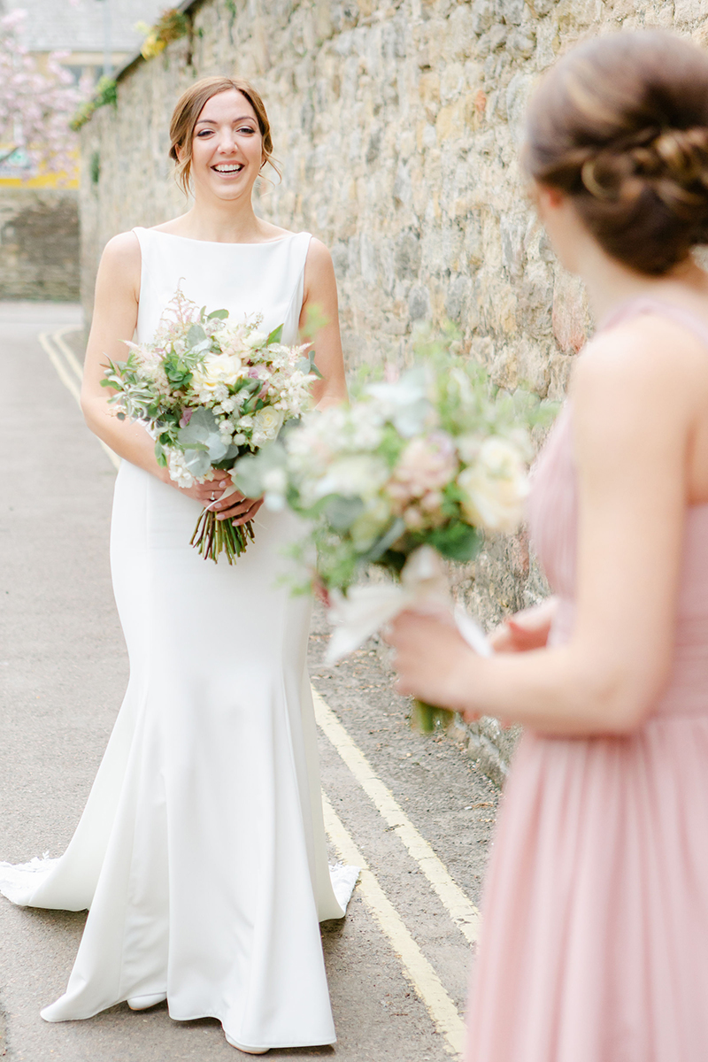 bride walking to bridesmaids