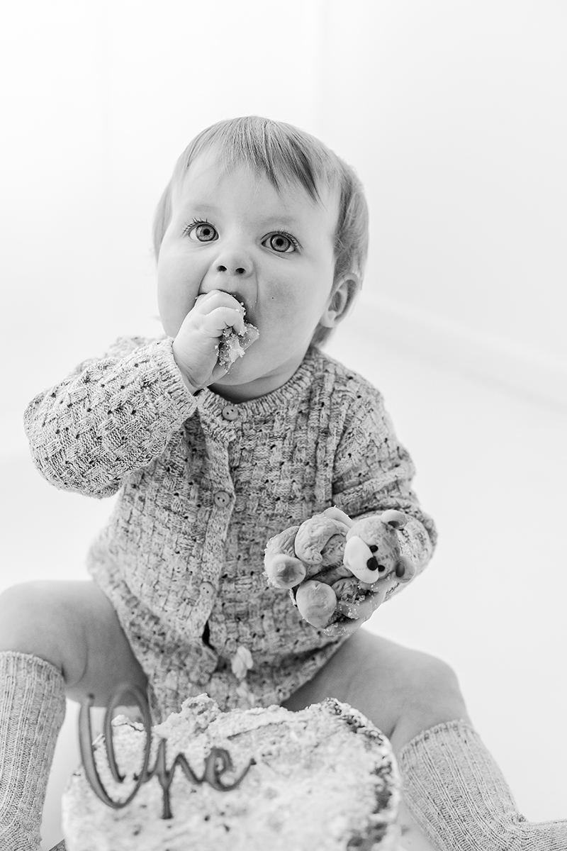 toddler eating cake black and white